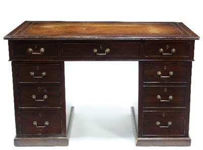 Lot 584 - A mahogany kneehole desk fitted a surround of...