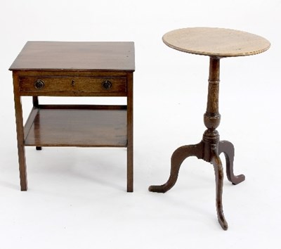 Lot 592 - A mahogany two-tier table, fitted a drawer on...