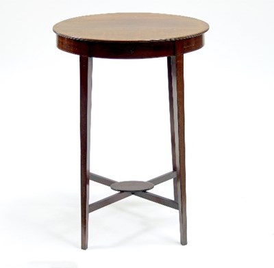 Lot 594 - An Edwardian mahogany oval table, on square...