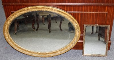 Lot 596 - An oval wall mirror with gilded frame, 86cm...