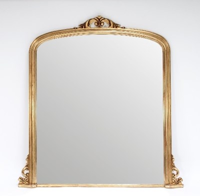 Lot 606 - A gilded overmantel mirror with scroll...