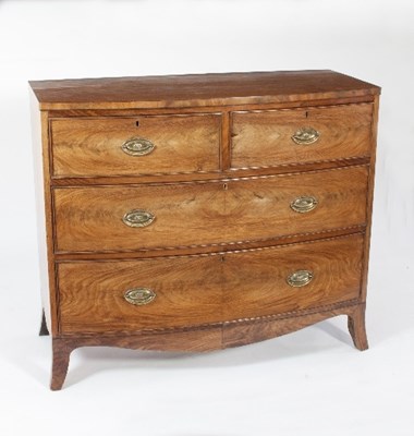 Lot 621 - A George III mahogany bowfront chest of two...