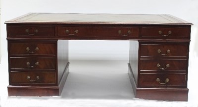 Lot 628 - A mahogany partners' desk, the top with inset...