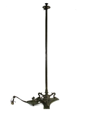 Lot 630 - A bronze standard lamp, modelled as an oil...