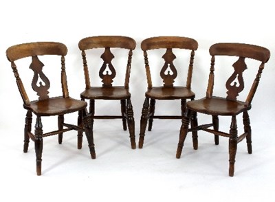 Lot 644 - Four kitchen chairs, each with pierced upright...