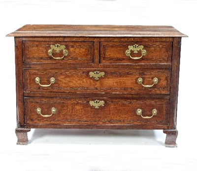 Lot 649 - An 18th Century oak chest, the triple-plank...