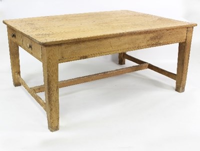 Lot 652 - A large pine kitchen table, the planked top...