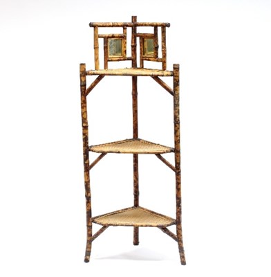 Lot 655 - A bamboo framed corner whatnot, the...