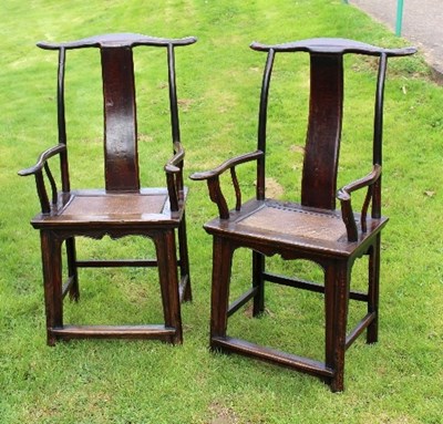 Lot 662 - A pair of Chinese elm yoke back chairs