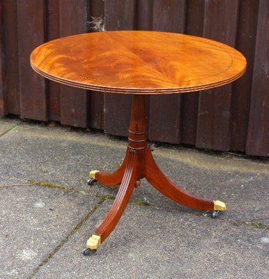 Lot 663 - A circular mahogany table on tripod base, 60cm...