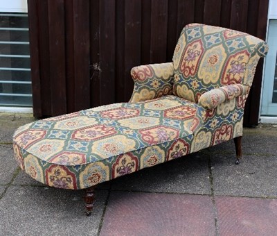 Lot 666 - An upholstered day bed on turned legs with...