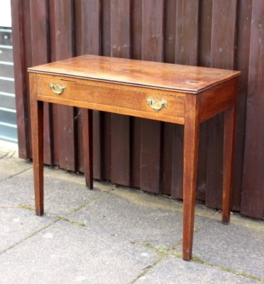 Lot 667 - An elm side table fitted a single drawer, 87cm...