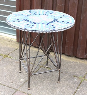 Lot 668 - A mosaic top table on metal base