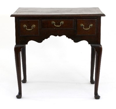 Lot 672 - A George III oak lowboy, fitted three drawers...