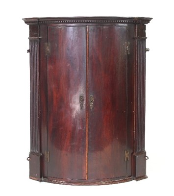 Lot 683 - A 19th Century mahogany bowfront corner...