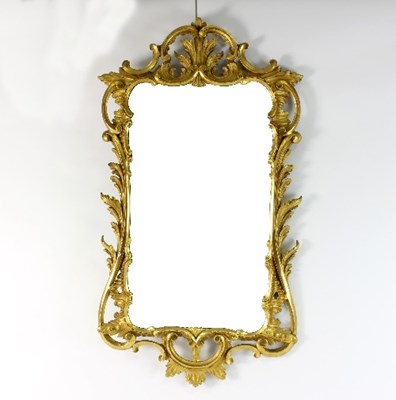 Lot 684 - A Rococo style gilt frame mirror of scrolling...