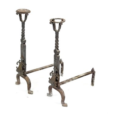 Lot 688 - A pair of wrought iron fire dogs with twisted...