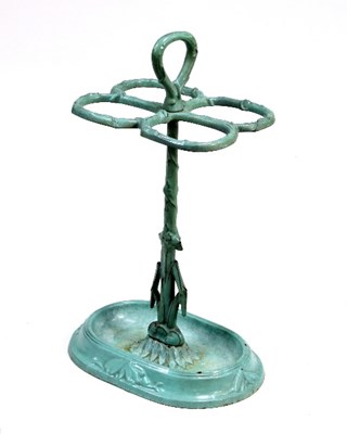 Lot 701 - A cast iron umbrella stand with turquoise...