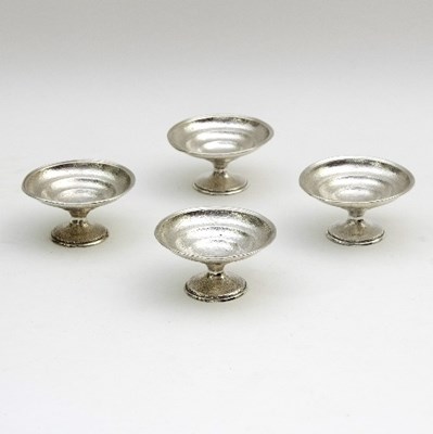 Lot 20 - A set of four Chinese white metal footed bowls...