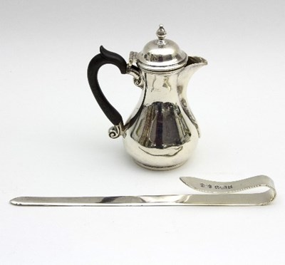 Lot 61 - A small silver hot milk pot, London 1911, with...