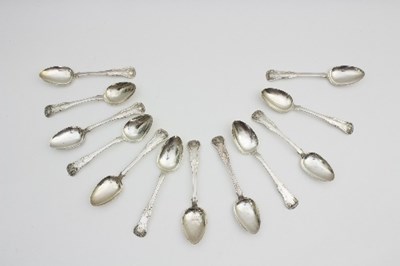 Lot 68 - A set of eleven Scottish silver dessert spoons,...