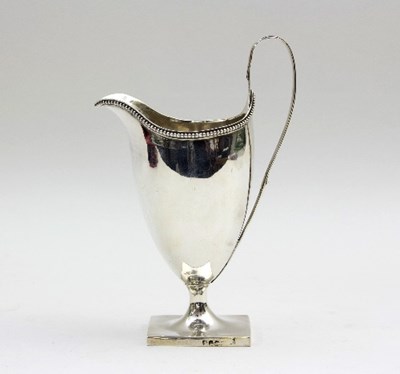 Lot 92 - A George III silver jug, marks rubbed, with...