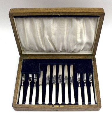 Lot 95 - A set of mother-of-pearl handled silver...