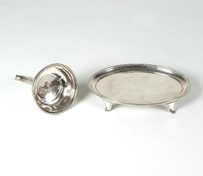 Lot 112 - A George III silver teapot stand, John Emes,...