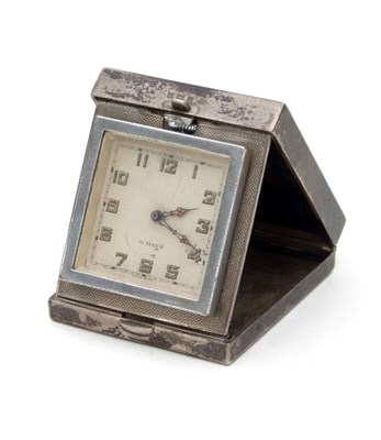 Lot 127 - A silver cased folding bedside clock, R&S,...