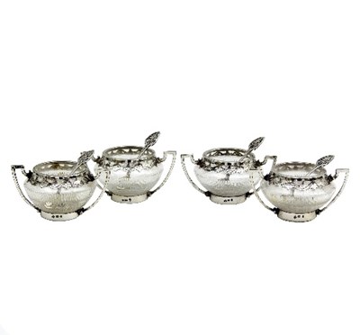 Lot 164 - A set of four Victorian silver mounted salts,...