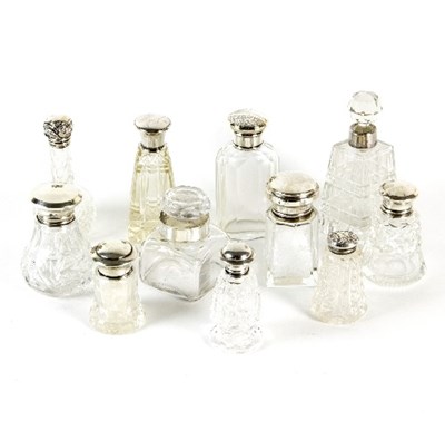 Lot 197 - Eleven silver mounted scent bottles, various...