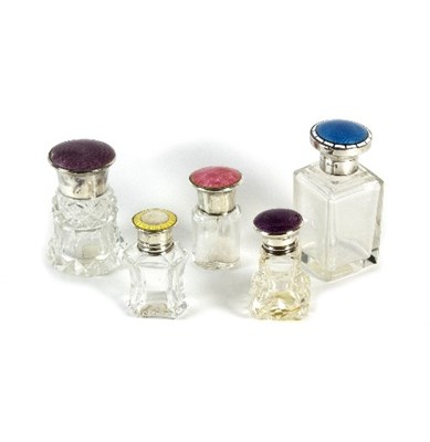 Lot 202 - Five enamel and silver mounted scent bottles,...