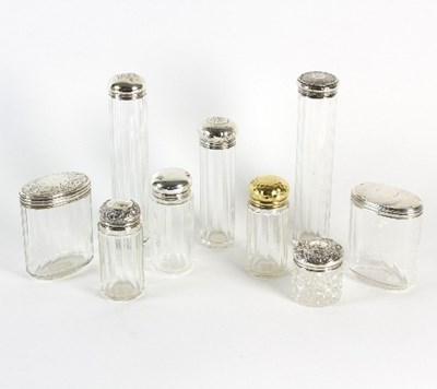 Lot 204 - Nine silver top jars, various dates and makers,...