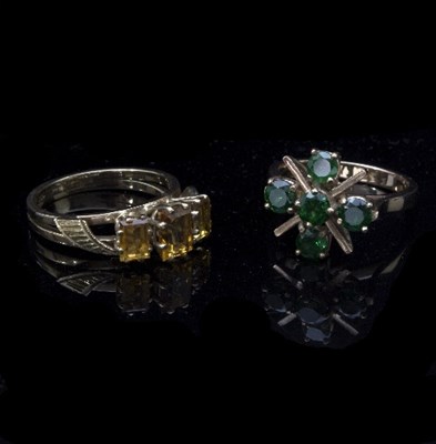 Lot 210 - Two gem set dress rings, in modern gold settings