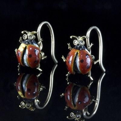 Lot 214 - A pair of ladybird earrings, each with diamond...