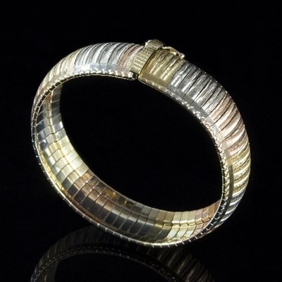 Lot 216 - A tri-coloured 18ct gold snake link bracelet...