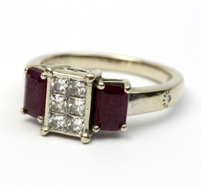 Lot 235 - A ruby and diamond dress ring, the centre set...