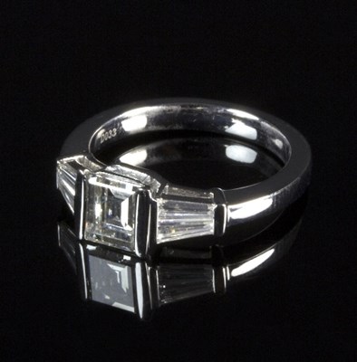 Lot 248 - An emerald cut diamond solitaire ring,...