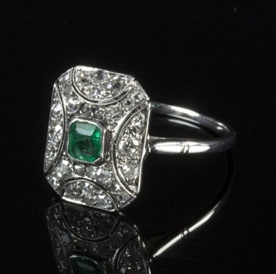 Lot 249 - An Art Deco style emerald and diamond dress...