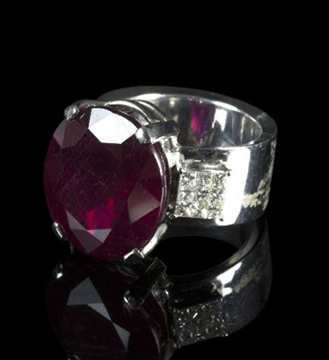 Lot 252 - A ruby and diamond dress ring, the central...