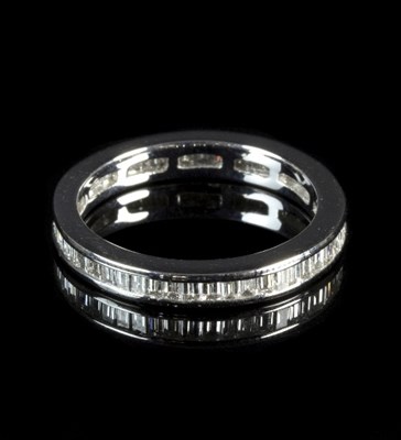 Lot 256 - A diamond eternity ring, set with baguette cut...