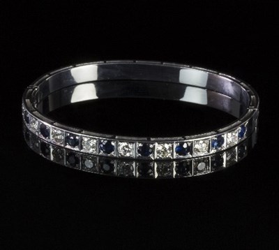 Lot 259 - A sapphire and diamond set 18ct white gold...