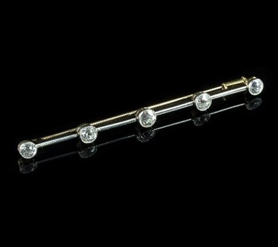 Lot 266 - A diamond bar brooch of five spaced stones...