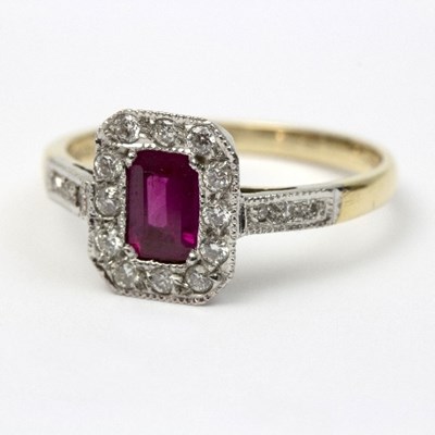 Lot 269 - A ruby and diamond dress ring to a white metal...