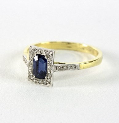 Lot 270 - A sapphire and diamond dress ring to a white...