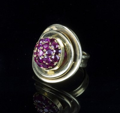 Lot 271 - An 18ct gold and ruby dress ring of modern...