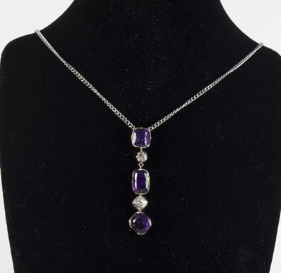 Lot 273 - An amethyst and diamond pendant necklace, the...