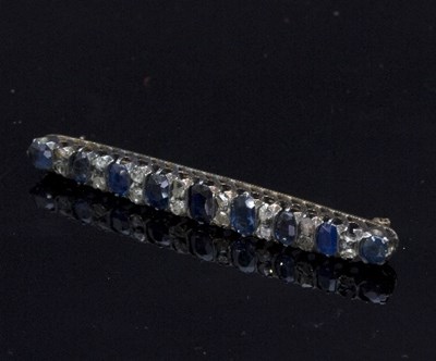 Lot 278 - A sapphire and diamond bar brooch, the nine...