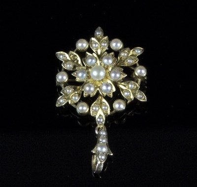 Lot 292 - A seed pearl pendant/brooch of flowerhead form...