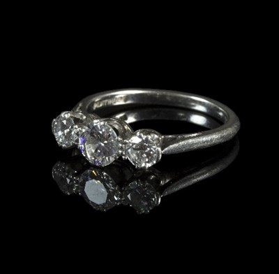 Lot 296 - A diamond three-stone ring, in a platinum...